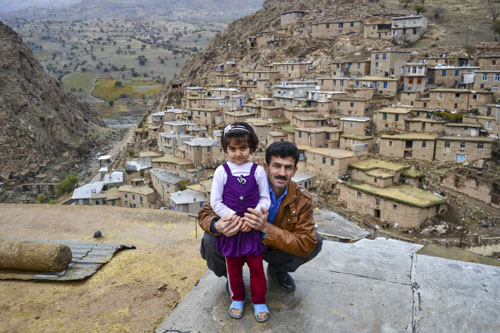 A father hugging his daughter in Palangan, Iranian Kurdistan.